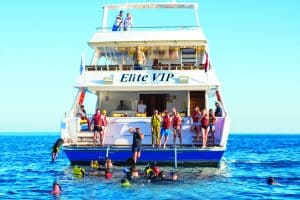 Elite VIP Cruise boat in Sharm El Sheikh, cruising the Red Sea with spacious decks for relaxation and sunbathing, offering luxury tours to Ras Mohammed National Park.