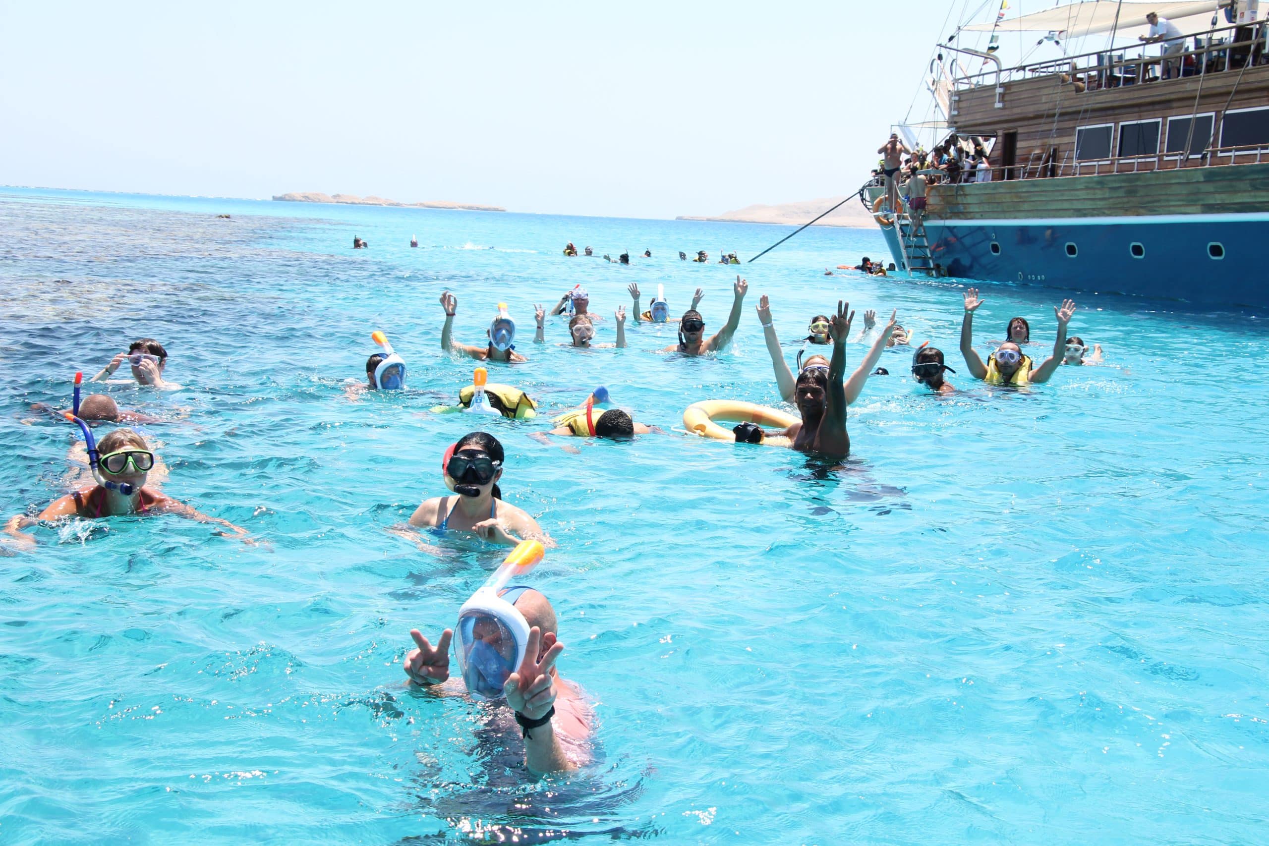 14 Guests snorkeling in Ras Mohammed National Park near Sharm El Sheikh, exploring coral reefs and marine life on the Pirates Cruise.